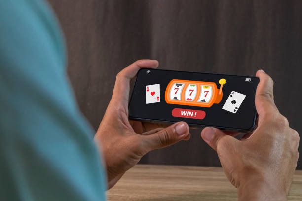 Golden Toad slot interface on realbet mobile showing reels, paylines, and balance